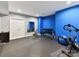 Bright exercise room equipped with weights, exercise bike, mirror, and rubber flooring at 105 Beech Bluff Dr, Mount Holly, NC 28120