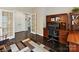 Office space featuring hardwood floors, a built-in desk, and double doors to maximize privacy at 105 Beech Bluff Dr, Mount Holly, NC 28120
