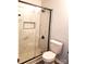Modern bathroom showcasing a walk-in shower with marble-like tiles and black trim at 11010 Harrowfield Rd, Charlotte, NC 28226
