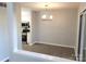 Open dining room area, new flooring and kitchen view at 11010 Harrowfield Rd, Charlotte, NC 28226
