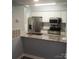 Kitchen features stainless steel appliances, granite countertops and white cabinets at 11010 Harrowfield Rd, Charlotte, NC 28226