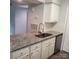 Bright kitchen with granite countertops, stainless steel sink, and updated faucet at 11010 Harrowfield Rd, Charlotte, NC 28226