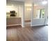 Open floor plan featuring a view from living room into kitchen and dining area at 11010 Harrowfield Rd, Charlotte, NC 28226