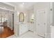 Elegant bathroom with marble countertops, gold fixtures, and tiled floors, offering a spa-like experience at 11723 Oakland Hills Pl, Charlotte, NC 28277