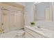 Bright bathroom featuring shower and bathtub combination and a vanity with mirror and overhead lighting at 11723 Oakland Hills Pl, Charlotte, NC 28277