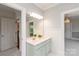 Bathroom features double sinks, vanity lights, and mirrors and has an opening to another area at 11723 Oakland Hills Pl, Charlotte, NC 28277