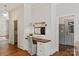 Cozy hallway nook with built-in desk and storage, illuminated by modern sconces at 11723 Oakland Hills Pl, Charlotte, NC 28277
