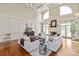 Bright and airy living room with high ceilings, fireplace, and hardwood flooring at 11723 Oakland Hills Pl, Charlotte, NC 28277