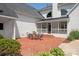 Back patio with outdoor dining furniture and a view of the screened-in porch at 11723 Oakland Hills Pl, Charlotte, NC 28277