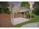 Charming pergola with concrete flooring, nestled in a serene garden setting, ideal for relaxation and entertaining at 11723 Oakland Hills Pl, Charlotte, NC 28277