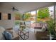 Cozy screened porch with comfortable seating, offering a peaceful retreat with views of the lush backyard at 11723 Oakland Hills Pl, Charlotte, NC 28277