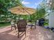 Backyard patio features a full outdoor seating set, grill, and green foliage at 11909 Creek Turn Dr, Charlotte, NC 28278