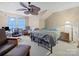 Bedroom featuring ceiling fan, computer desk, and single bed at 11909 Creek Turn Dr, Charlotte, NC 28278