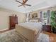 Comfortable bedroom featuring a large bed, neutral colors, and ample natural light at 11909 Creek Turn Dr, Charlotte, NC 28278