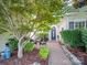 Charming front entrance with a seating area, landscaping, and a stone walkway to the front door at 11909 Creek Turn Dr, Charlotte, NC 28278