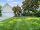 Charming home with well-manicured lawn and beautiful landscaping at 11909 Creek Turn Dr, Charlotte, NC 28278