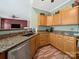 Kitchen with oak cabinets and stainless steel appliances at 11909 Creek Turn Dr, Charlotte, NC 28278