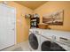Functional laundry room with modern washer and dryer set at 11909 Creek Turn Dr, Charlotte, NC 28278
