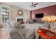 Inviting living room with a cozy fireplace, plush seating, and large windows for natural light at 11909 Creek Turn Dr, Charlotte, NC 28278