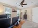 Home office with desk, monitors, and ample natural light at 11909 Creek Turn Dr, Charlotte, NC 28278