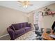 Versatile office space with sofa, desk, and ceiling fan at 11909 Creek Turn Dr, Charlotte, NC 28278