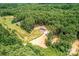 Distant aerial view of a one story home surrounded by lush forestry at 122 River Ridge Ln, Hickory, NC 28601