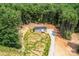 Aerial view of a one story home featuring gray exterior, new landscaping, and a gravel driveway at 122 River Ridge Ln, Hickory, NC 28601