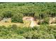 Distant aerial view of a one story home surrounded by lush forestry at 122 River Ridge Ln, Hickory, NC 28601