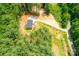 Distant aerial view of a one story home surrounded by lush forestry at 122 River Ridge Ln, Hickory, NC 28601