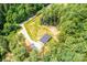 Distant aerial view of a one story home surrounded by lush forestry at 122 River Ridge Ln, Hickory, NC 28601