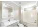 Bright bathroom featuring a shower and tub combination with a modern sink and mirror at 122 River Ridge Ln, Hickory, NC 28601