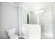 Modern bathroom featuring glass shower doors, white marble tile and contemporary fixtures at 122 River Ridge Ln, Hickory, NC 28601