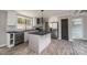 Well-lit kitchen featuring an island, stainless steel appliances, and modern fixtures at 122 River Ridge Ln, Hickory, NC 28601