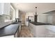 Charming kitchen with stainless appliances, island with a black countertop and modern lighting at 122 River Ridge Ln, Hickory, NC 28601