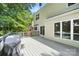 Spacious backyard deck with grill, adjacent to siding with multiple windows at 12712 Hollyhock Ln, Huntersville, NC 28078
