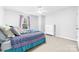 Bright bedroom with a queen bed, plush pillows, and plenty of natural light at 12712 Hollyhock Ln, Huntersville, NC 28078