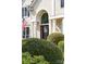 Charming home featuring front entrance, adorned with decorative door decor and manicured bushes at 12712 Hollyhock Ln, Huntersville, NC 28078