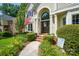 Inviting front entrance with brick steps and beautiful landscaping at 12712 Hollyhock Ln, Huntersville, NC 28078