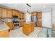 Charming kitchen featuring stainless steel appliances, granite countertops, a central island and cabinetry with pendant lighting at 12712 Hollyhock Ln, Huntersville, NC 28078