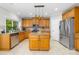 Well-equipped kitchen with stainless steel appliances, granite countertops, kitchen island and cabinetry with stylish pendant lights at 12712 Hollyhock Ln, Huntersville, NC 28078