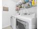Laundry room features a modern washer and dryer set, and plenty of storage at 12712 Hollyhock Ln, Huntersville, NC 28078