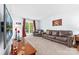 Comfortable living room featuring a leather sofa and natural light at 12712 Hollyhock Ln, Huntersville, NC 28078