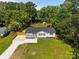 Aerial view of a home with a manicured lawn, fenced yard, and outbuilding at 1319 Mt Gallant Rd, Rock Hill, SC 29732