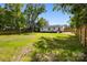 Large backyard with a privacy fence, shed, and ample lawn space at 1319 Mt Gallant Rd, Rock Hill, SC 29732