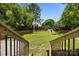 Fenced backyard with green grass and an outbuilding at 1319 Mt Gallant Rd, Rock Hill, SC 29732