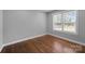 Sunlit bedroom featuring hardwood floors and a large window, providing ample natural light at 1319 Mt Gallant Rd, Rock Hill, SC 29732