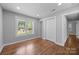 Cozy bedroom with hardwood floors, a window, and closet space, perfect for relaxation at 1319 Mt Gallant Rd, Rock Hill, SC 29732