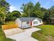 Charming single-story home with a bright red door, manicured landscaping, and a newly paved driveway at 1319 Mt Gallant Rd, Rock Hill, SC 29732