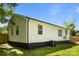 View of the rear exterior showcasing the well-maintained white siding and a spacious yard at 1319 Mt Gallant Rd, Rock Hill, SC 29732