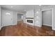Spacious living room with hardwood floors and a chic electric fireplace providing comfort and style at 1319 Mt Gallant Rd, Rock Hill, SC 29732